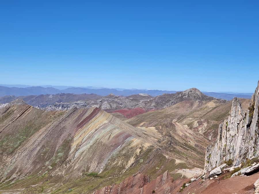 From Cusco: Palcoyo Rainbow Mountain Guided Tour - The stone forest and the view toward Ausangate
