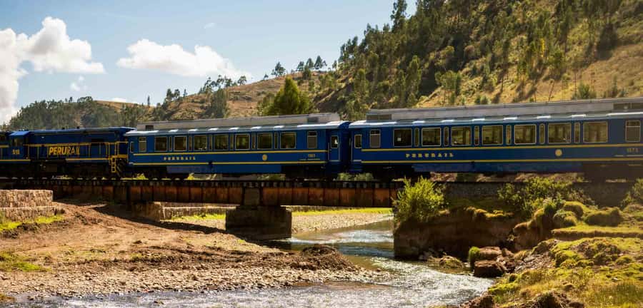 From Cusco: Train Ride and Guided Tour of Machu Picchu - Arriving in Aguas Calientes and heading uphill