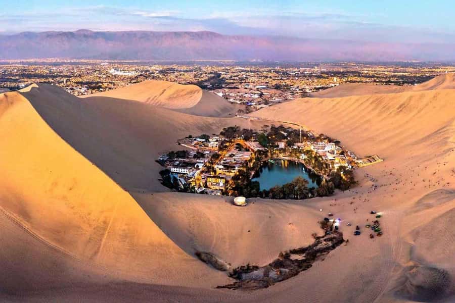 From Lima: Ballestas Islands, Huacachina and Wine Route Trip - Paracas pier and the Ballestas boat