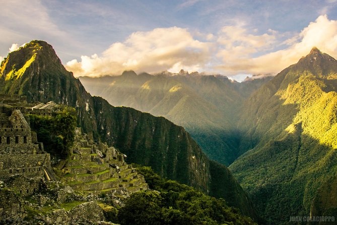Machu Picchu Trips One Day Tour with Inca Rail Train from Cusco - Entering Machu Picchu with a guide
