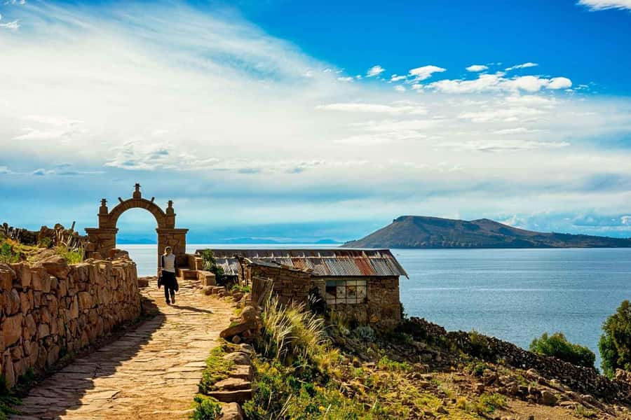 Puno: Uros and Taquile Islands Full-Day Tour with Lunch - Walking on the floating Uros Islands